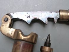 Two brass shotgun cartridge reloading tools comprising a 12 bore rollover tool and a 16 bore capper/