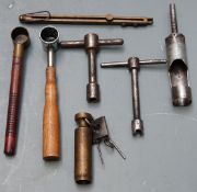 Seven shooting/ reloading tools comprising a brass spring loaded percussion cap dispenser, two