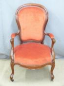 Spoonback upholstered armchair and a shieldback dining chair