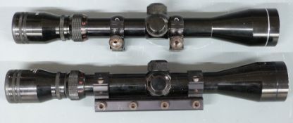 Two Bushmaster 3-9x40 rifle scopes with scope mounts.