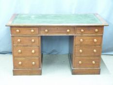 A 19th/20thC mahogany leather inset twin pedestal desk, W132 x D60 x H77cm
