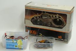 Spektrum DX6i 2.4ghz radio control transmitter in original box together with a Spektrum AR4000