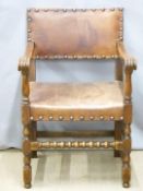 A leather upholstered oak armchair, H87cm