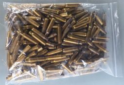 One-hundred-and-fifty 7.62 primed brass rifle cartridge cases.