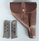 Walther PP brown leather pistol holster stamped to the inside together with two Walther PP