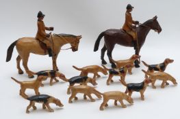 Wooden carved huntsmen on horseback and hound, in Berkeley Hunt livery