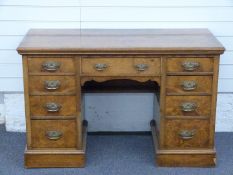 A 19th/20thC pollard oak or burrwood twin pedestal desk with graduated drawers, W122 x D56 x H77