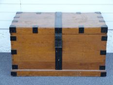 A 19thC metal-bound oak silver chest with velvet lining, lift out tray, looped drop handles and
