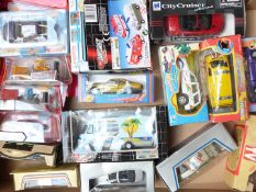 Eighteen New Ray, Dickie, Lledo and similar diecast model vehicles including Disney Pixar Cars,