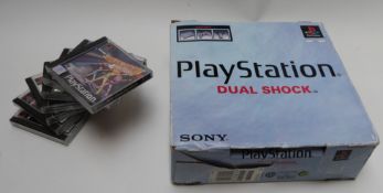 Sony PlayStation Dual Shock video games console and seven games including Madden, WWF Smackdown,