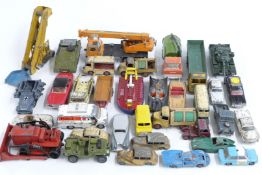 Thirty-four Corgi and Dinky Toys diecast model vehicles including Batmobile, Kodak Cameras Bedford