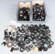 A large collection of pairs of scope mounts of various sizes.
