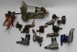 Twelve OS glow ignition model aircraft engines to include LA40, 25, 61, 30 and Max FP 25