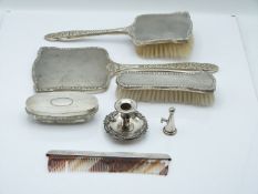 Elizabeth II hallmarked silver dressing table set with floral embossed decoration, comprising hand
