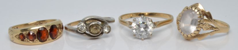Three 9ct gold rings and a 9ct gold and silver ring
