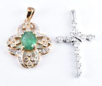 A 9ct gold pendant set with an emerald and diamonds and a 9ct white gold cross pendant set with
