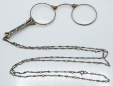White metal lorgnettes set with marcasite and paste and a silver chain/ necklace set with paste,