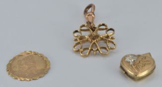 A 9ct gold St Christopher, 9ct gold locket and 9ct gold brooch, 4.5g and a fob watch chain clasp