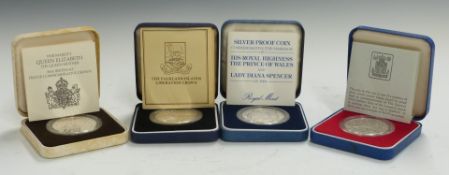 Four cased commemorative silver proof crowns comprising Royal Mint 1977 Silver Jubilee, 1980 Queen