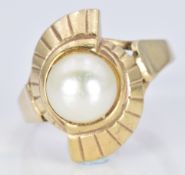 A 9ct gold ring set with a pearl, 5.4g, size P