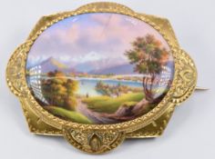 Victorian brooch set with a miniature enamelled landscape with script verso 'Vue de Geneve over Le