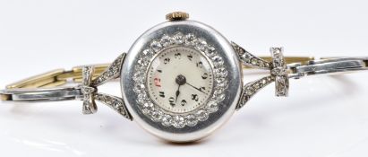 Victorian/ Edwardian 18ct gold ladies watch with platinum finish, set with diamonds around the