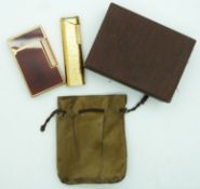 Two Dupont lighters, one in original box, together with a Pierre Cardin lighter