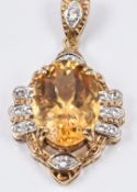 A 9ct gold pendant set with a large citrine and diamonds, 9.1g