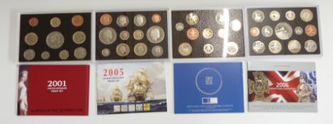 Four Royal Mint proof deluxe coin sets, 2001, 2004, 2005, and 2006, with certificates