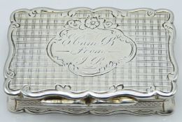 George Unite Victorian hallmarked silver snuff box of shaped form with engine turned decoration,