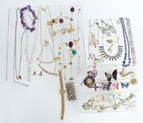 A collection of costume jewellery including vintage brooches, silver ring, rings, necklaces etc