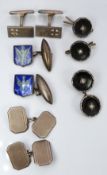 A pair of silver cufflinks set with enamel, two further pairs of silver cufflinks and buttons