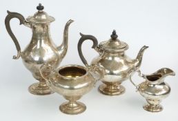 Garrard Victorian hallmarked silver four piece teaset of pedestal design with engraved decoration,