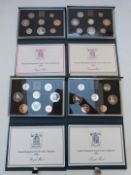 Royal Mint UK proof coin collections in deluxe cases with certificates, 1983-1986