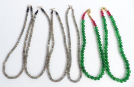 A collection of necklaces including quartz and labradorite