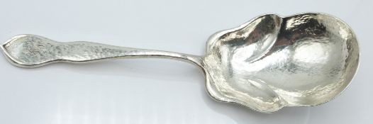 A Stowell and Son American Sterling silver hammered Arts & Crafts or Art Nouveau style serving spoon