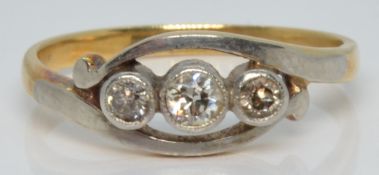 An 18ct gold ring set with three diamonds in platinum setting, 2.2g, size J