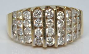 A 14k gold ring set with nine rows of diamonds in a tiered setting, 6.0g, size M/N