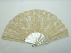 A 19thC mother of pearl and lace fan, width 41cm