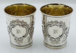 WITHDRAWN    Pair of Georgian hallmarked silver beakers with gilt wash interiors and embossed