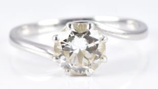 A platinum ring set with a round cut diamond of approximately 1.65ct in a twist setting, 5.1g,