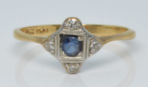 An 18ct gold ring set with a sapphire and diamonds in a platinum setting, 2.3g, size Q