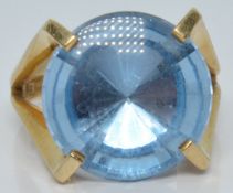 A 9ct gold ring set with a round mixed cut aquamarine, 7.0g, size O