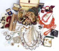 A collection of costume jewellery including vintage boxes, cameo brooches, diamanté, pearl necklace,