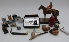 A horse and jockey table lighter, further lighters and pipes including Meerschaum and clay pipes