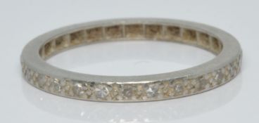 A platinum eternity ring set with diamonds, 2.4g, size M