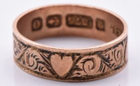 A 9ct gold child's ring with engraved heart decoration, Birmingham 1913, 0.8g