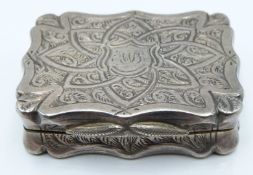 Victorian hallmarked silver vinaigrette of shaped form with engraved decoration and pierced gilt