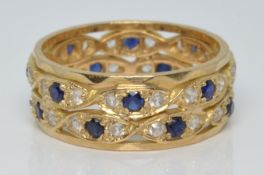 A 9ct gold eternity ring set with a sapphires and cubic zirconia, 4.7g, size P/Q