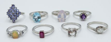 Eight silver rings set with ametrine, tanzanites, ruby, zircon, itinga petalite, lavender quartz,